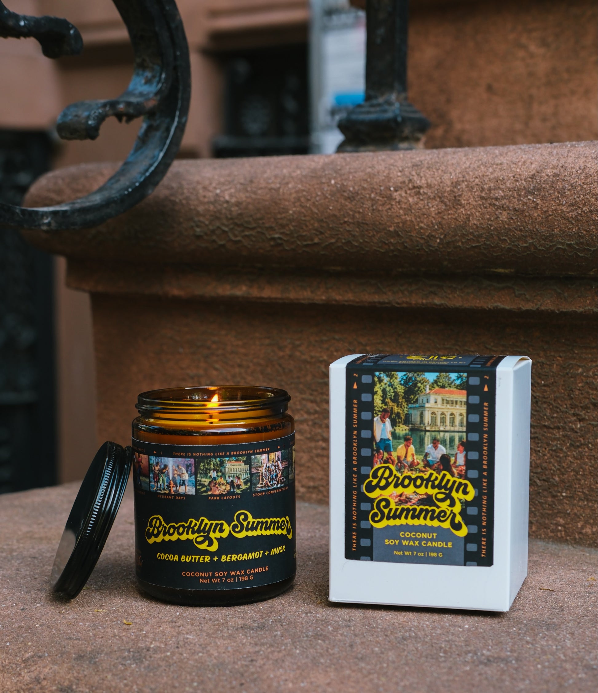 Candle and packaging of Brooklyn Summer on a stone surface