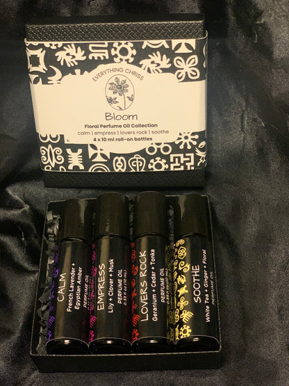 Set of perfume oils with decorative packaging on a black background